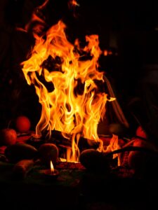 temple worship traditional items evening aarti arti rituals gods god pooja india prayer instrument kartik bell thali table durga kalash havan red family food festival set