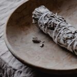 ceramic plate with white sage smudge stick