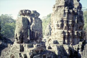 Secularism,sculptures from bayon temple complex in cambodia